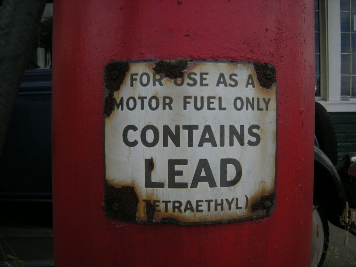Measuring Lead Exposure - Old Fuel Tank Featuring Rusted Lead Warning Sign
