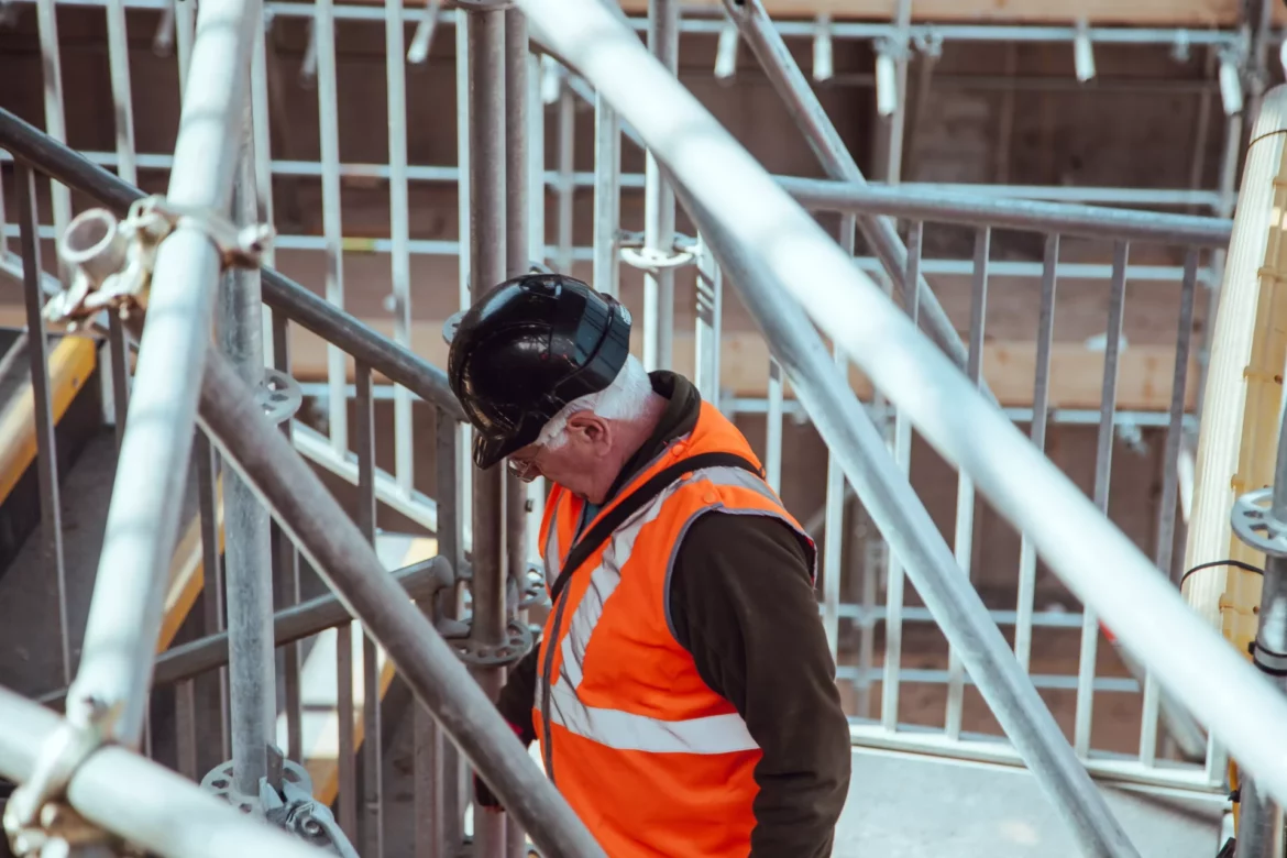 Factors affecting the use or non-use of personal protective equipment in the workplace and recommended interventions - man in construction gear