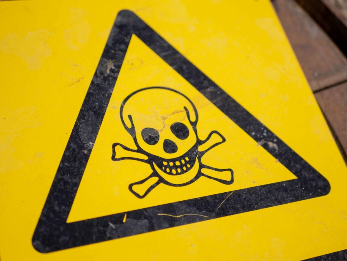 Asbestos: A Hidden Health Risk in the Workplace - yellow and black caution sign