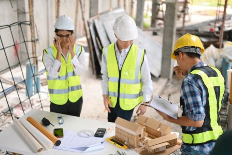 construction workers discussing psychosocial risk assessment