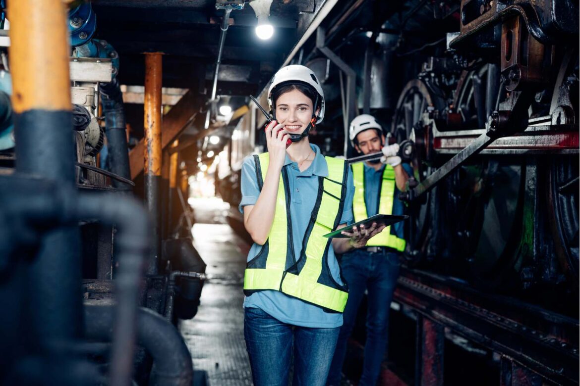 Women’s health in the workplace highlighted by female workers in a manufacturing facility following workplace safety practices