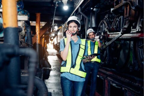 Women’s health in the workplace highlighted by female workers in a manufacturing facility following workplace safety practices