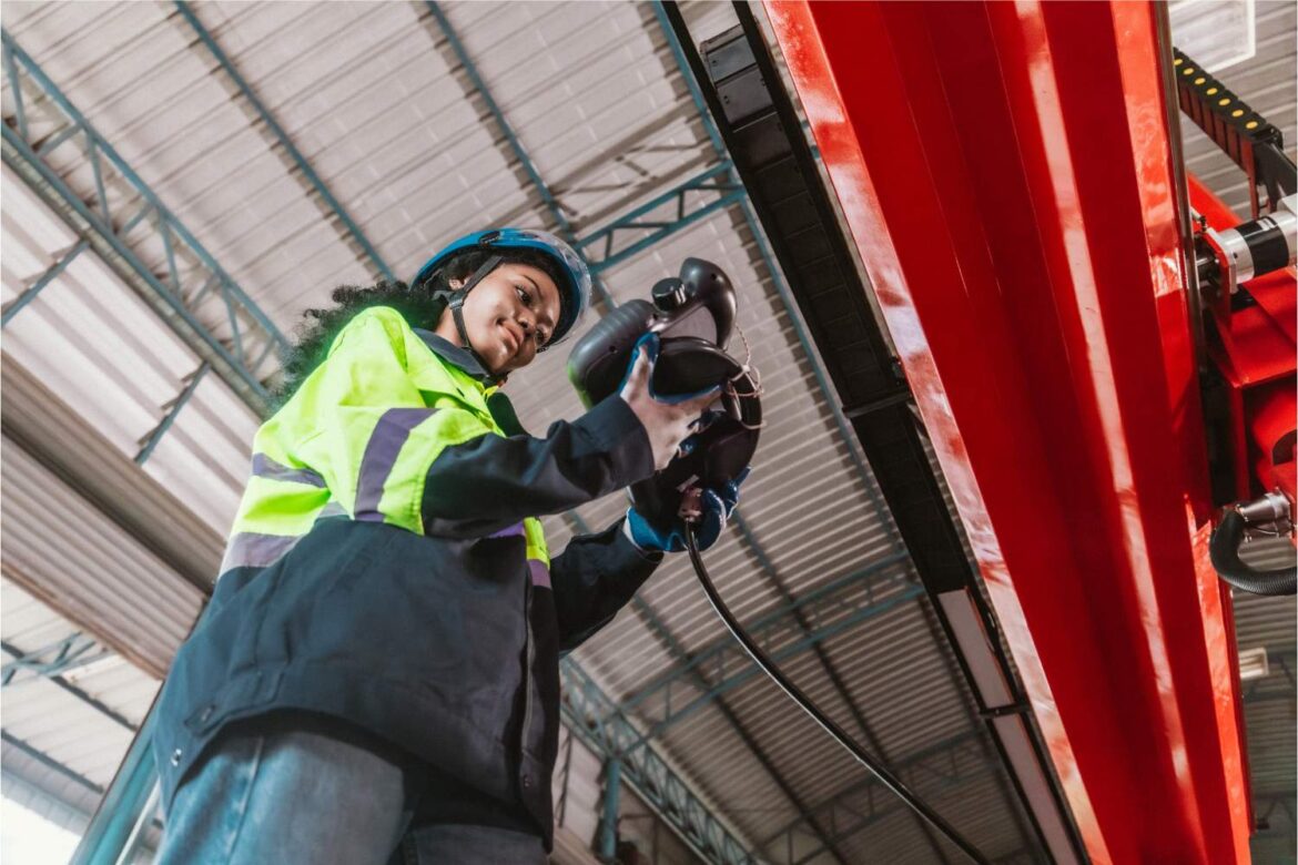Technician conducting vibration risk assessments on industrial pipework using handheld monitoring equipment